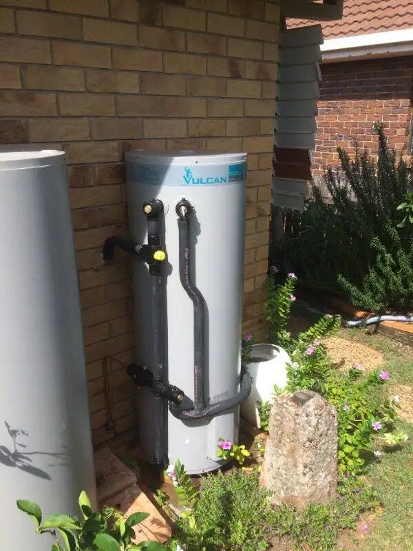 Vulcan hot water system outdoor installation, energy-efficient home heating solution