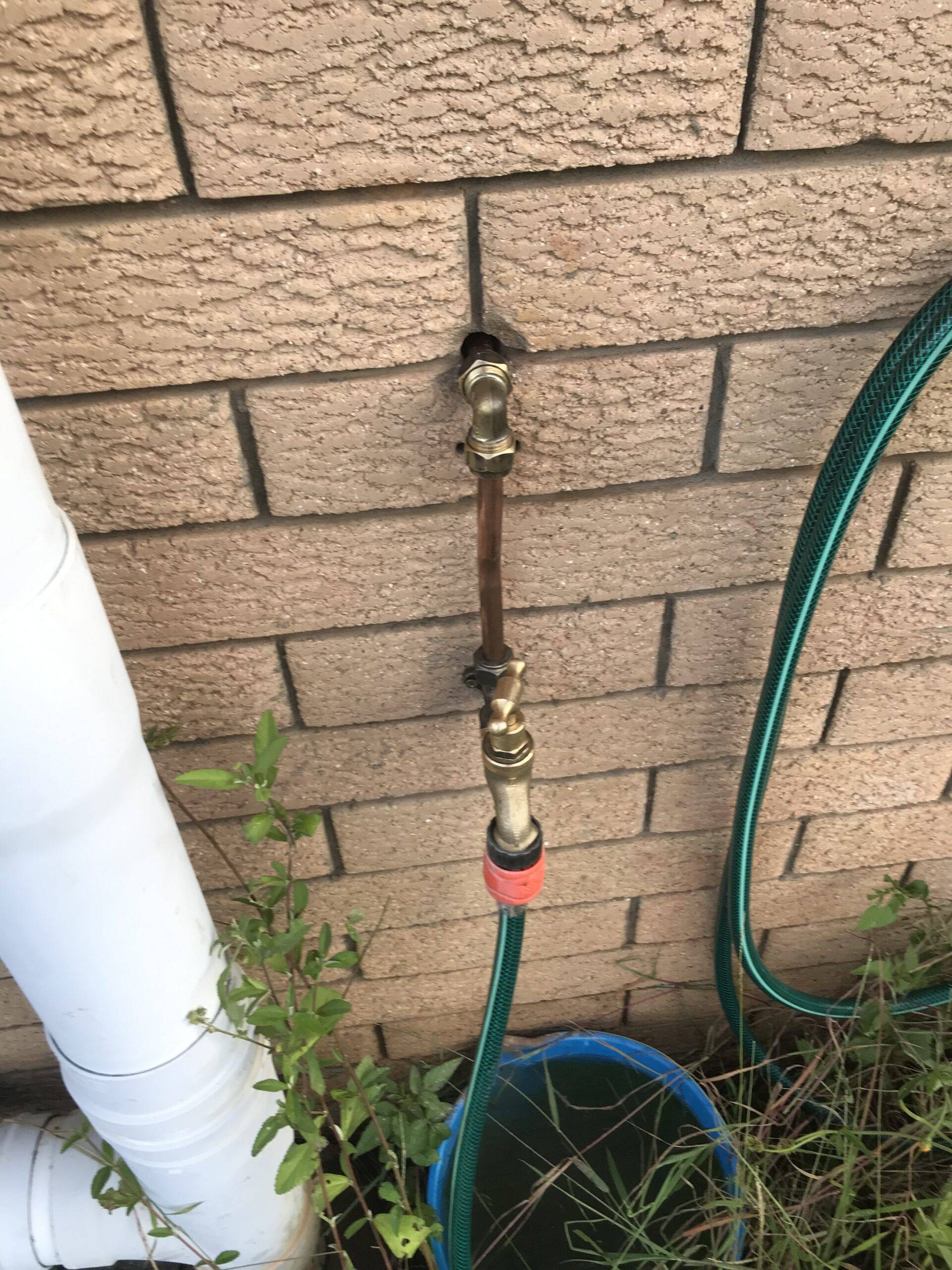 Outdoor gas connection installation on Brisbane home brick wall